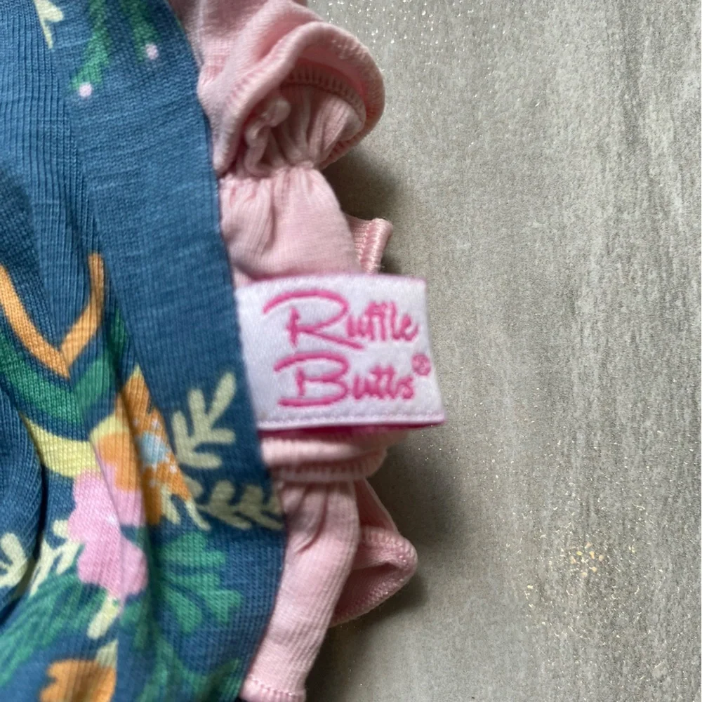 NWT RuffleButts Dark Blue & Pink Floral Rainbows Ruffles Bubble Romper, 0-3M